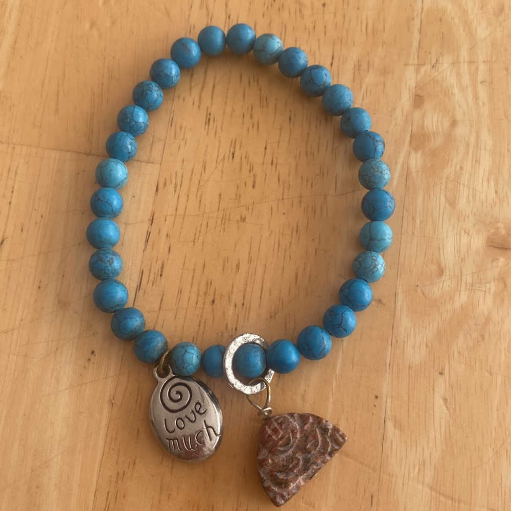 Blue turquoise colored round beaded bracelet with charms Stretch